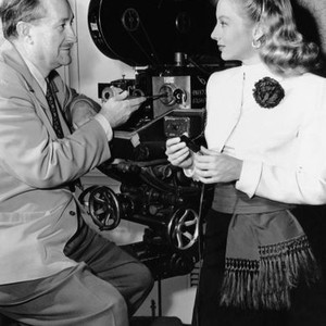 THE MATING OF MILLIE, cameraman Joseph Walker, left, and Evelyn Keyes, on-set, 1948