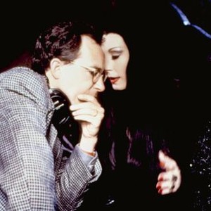 ADDAMS FAMILY VALUES, director Barry Sonnenfeld, Anjelica Huston, on set, 1993. ©Paramount