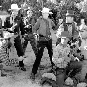 THUNDERING GUN SLINGERS, second, third, fourth, fifth, sixth, seventh and eighth from left: Al St John, Buster Crabbe, Budd Buster, Bert Dillard, Jack Ingram, Augie Gomez, Charles King, 1944
