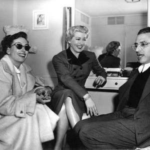 A LIFE OF HER OWN, Joan Crawford, left, visits Lana Turner, director George Cukor, on-set, 1950