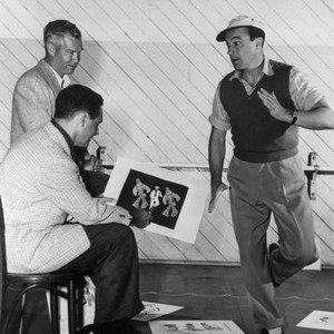 INVITATION TO THE DANCE, animators William Hanna, Joseph Barbera sketch Gene Kelly's dance movements for the cartoon sequence, 1956
