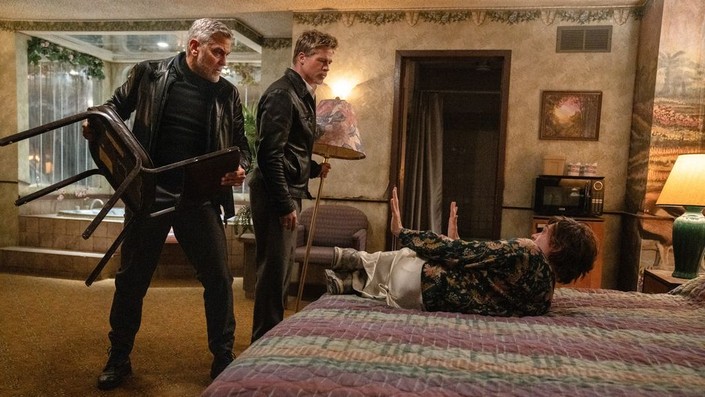 (L–R) Margaret's Man (George Clooney), Pam's Man (Brad Pitt), and The Kid (Austin Abrams) in "Wolfs." (Apple Original Films)