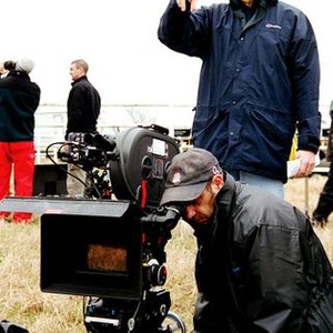 INFAMOUS, director Douglas McGrath (standing) and cinematographer Bruno Delbonnel (at camera), on set, © 2006 Warner Bros. Entertainment Inc.