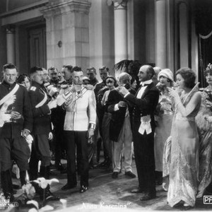 LOVE, (aka ANNA KARENINA), John Gilbert (white tunic, center left), Brandon Hurst (tuxedo, balding, right center), Greta Garbo as Anna Karenina (third from right, high collar), George Fawcett (far right), 1927