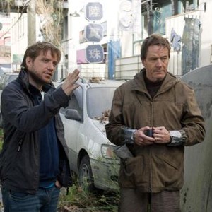 GODZILLA, from left: director Gareth Edwards, Bryan Cranston, on set, 2014. ph: Kimberley French/©Warner Bross. Pictures