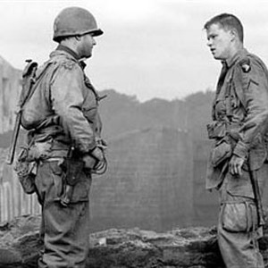Captain John Miller (TOM HANKS, left) finally meets up with Private James Ryan (MATT DAMON) who has no intention of abandoning his unit. photo 4