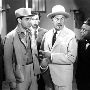 DARK ALIBI, Benson Fong (3rd from left in rear), Sidney Toler (center), Mantan Moreland (far right), 1946