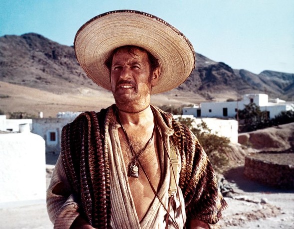 Tuco in his shirt-open-to-navel desert outfit, now with added big straw hat