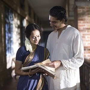 (L-R) Devika Bhise as Janaki and Dev Patel as Srinivasa Ramanujan in "The Man Who Knew Infinity." photo 20