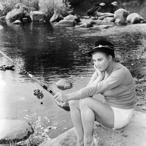 CATTLE KING, Joan Caulfield, relaxing on location, 1963