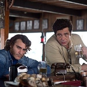 (L-R) Joaquin Phoenix as Larry "Doc" Sportello and Benicio Del Toro as Sauncho Smilax, Esq in "Inherent Vice."