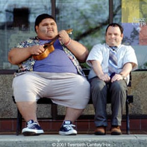 Mauricio (Jason Alexander) is a little overwhelmed by his ukulele-strumming acquaintance (Joshua "Li'iboy" Shintani).