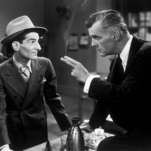 WHEN STRANGERS MARRY, (aka BETRAYED), from left: Lou Lubin, Neil Hamilton, 1944