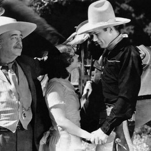 SADDLE BUSTER, from left: Richard Carlyle, Helen Foster, Tom Keene, 1932
