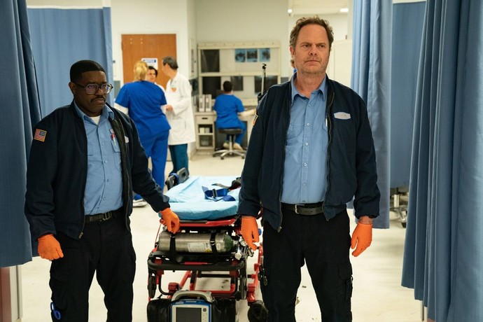 two EMT's with gurney in hospital in Code 3