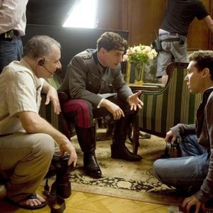 VALKYRIE, Tom Cruise as Claus von Stauffenberg (center), director Bryan Singer (right), on set, 2008. ©United Artists