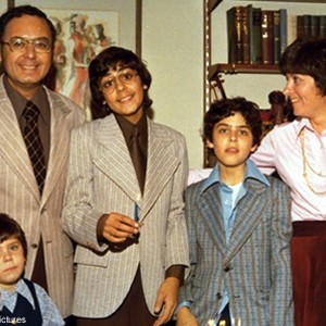 Arnold Friedman (father), Elaine Friedman (mother) and their three boys, Jesse (left) David (middle), and Seth (right) at David Friedman's bar mitzvah, from Capturing the Friedmans