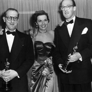 COMPOSERS JAY LIVINGSTON (LEFT) AND RAY EVANS (RIGHT) CONTRATULATED BY JANE RUSSELL FOR WINNING THE ACADEMY AWARD FOR THEIR SONG 'BUTTONS AND BOWS,' 1949