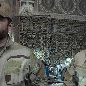 (L-R) Bradley Cooper as Chris Kyle and Luke Grimes as Marc Lee in "American Sniper."