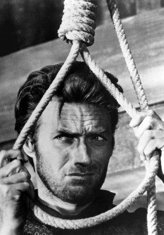 black and white image of Blondie putting his neck in the noose.