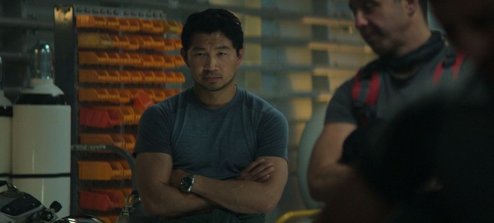 Dave "Vulcan" Yuasa (Simu Liu, center) and another crew member in "Last Breath." (Focus Features)