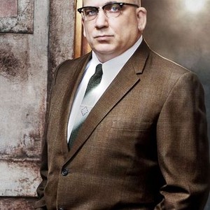 Jonny Coyne as Warden Edwin James