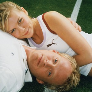American tennis champ Lizzie Bradbury (KIRSTEN DUNST) and low-ranked British tennis player Peter Colt (PAUL BETTANY) engage in a cross-court affair in Working Title Films' romantic comedy Wimbledon. photo 10