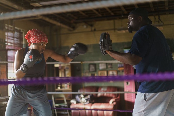 Claressa Shields (Ryan Destiny) and coach Jason Crutchfield (Brian Tyree Henry) hit mitts, in "The Fire Inside." (Amazon MGM Studios)