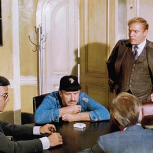 THE DOMINO PRINCIPLE, from left: Edward Albert, Gene Hackman, Ken Swofford, Richard Widmark (back to camera), 1977
