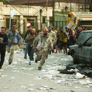 Spotting human survivors, a growing mob of undead chase their potential quarry in the zombie action thriller, Dawn of the Dead.