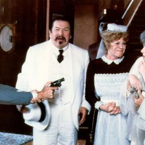 CHARLIE CHAN AND THE CURSE OF THE DRAGON QUEEN, from left: Brian Keith, Paul Ryan (gun), Peter Ustinov, Rachel Roberts, Lee Grant, Richard Hatch, Michelle Pfeiffer, 1981, © American Cinema Releasing
