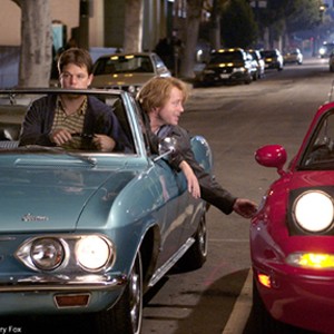 Bob (Matt Damon) grabs the wheel as Walt (Greg Kinnear) vies for the attentions of an attractive motorist (Kiele Sanchez). photo 1