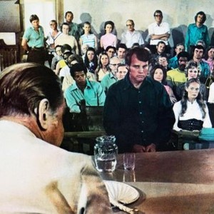 WALKING TALL, Felton Perry (second row of seats left), Joe Don Baker (standing center), Elizabeth Hartman (front row right), 1973