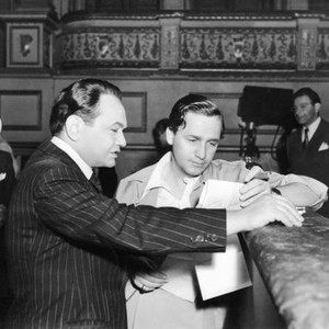 UNHOLY PARTNERS, from left: Edward G. Robinson, director Mervyn LeRoy, on set, 1941