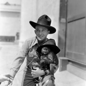 RHYTHM ON THE RANGE, Bing Crosby and friend on the Paramount backlot on set, 1936