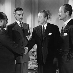 LUCKY NICK CAIN, shaking hands from left: Pter Illing, George Raft. Martin Benson (center), Hugh french (right), 1950