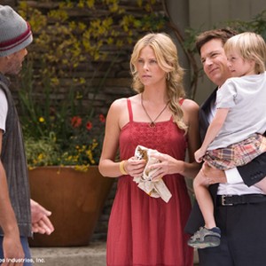 When disgruntled superhero Hancock (Will Smith, left) saves the life of PR exec Ray Embrey (Jason Bateman, center right), Ray takes Hancock home to meet the family - wife Mary (Charlize Theron, center left) and son Aaron (Jae Head, right) - in "Hancock." photo 7