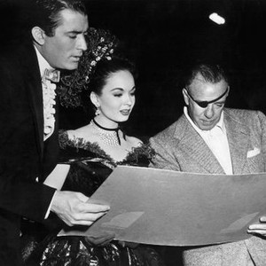 THE WORLD IN HIS ARMS, Gregory Peck, Ann Blyth, director Raoul Walsh examining Nova Scotia sea charts on set, 1952