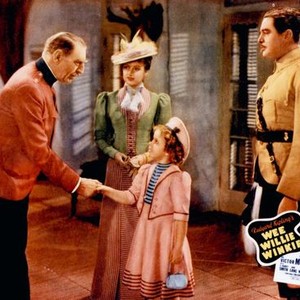 WEE WILLIE WINKIE, shaking hands from left: C. Aubrey Smith, Shirley Temple, June Lang (rear), Michael Whalen (right), 1937, TM & Copyright © 20th Century Fox Film Corp.