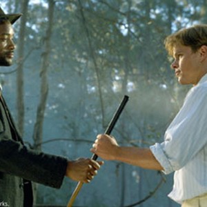 The mysterious caddie named Bagger Vance (WILL SMITH, left) hands a club to Rannulph Junuh (MATT DAMON, right) for the shot that will decide more than the match. photo 5