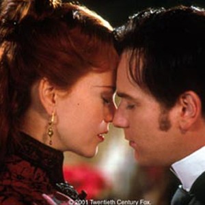 Satine (Nicole Kidman), "The Sparkling Diamond" and Christian (Ewan McGregor), a young poet who arrives in Paris to become a writer, fall deeply in love at the Moulin Rouge. photo 10
