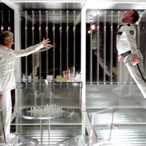 In his plastic prison, Magneto (Ian McKellen) uses his mutant powers to overcome a guard (Ty Olsson).