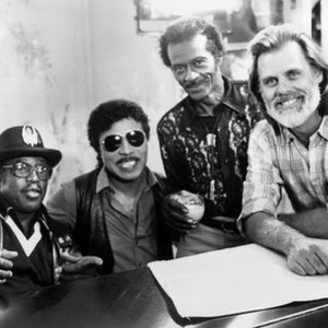 CHUCK BERRY HAIL! HAIL! ROCK 'N' ROLL, from left: Bo Diddley, Little Richard, Chuck Berry, director Taylor Hackford, on set, 1987. ©Universal Pictures