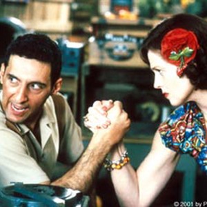 (Left to right) John Turturro as Agent Johnson with Sigourney Weaver as Daisy Quimp in COMPANY MAN.