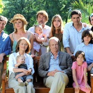 QUELQUE CHOSE A TE DIRE, (aka BLAME IT ON MUM), standing from left: Jerome Soubeyrand, Sophie Cattani, Olivier Marchal (holding baby), Mathilde Seigner, Pascal Elbe, Marina Tome; seated from left: Charlotte Rampling (holding baby), Patrick Chesnais, Daphne