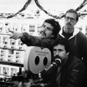 COBRA, director George Pan Cosmatos, assistant director Duncan Henderson, (back), cinematographer Rick Neff (below), on location, 1986, ©Warner Bros. /